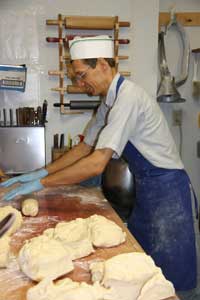 Ken Claudill rolling bread dough
